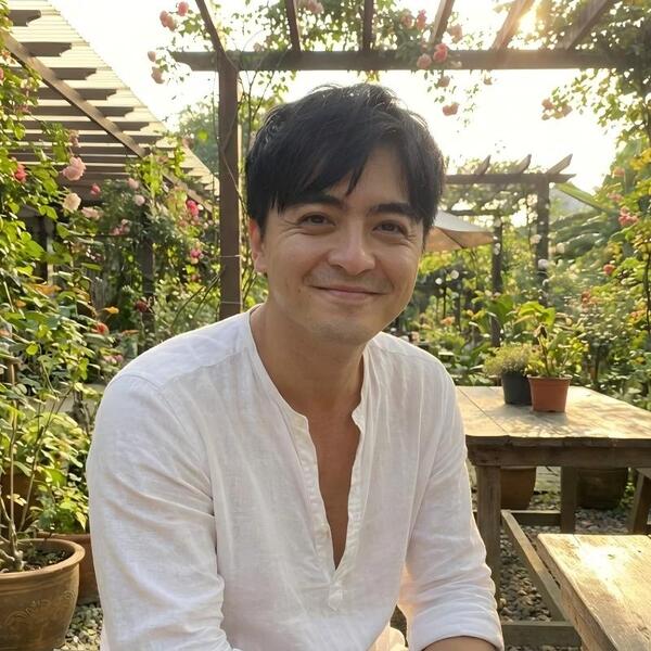 Original color photograph of Sifu Xion seated in a sunlit garden
